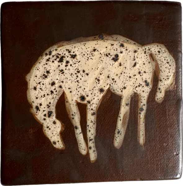 Square tile in dark glossy brown glaze with a speckled cream horse in relief.